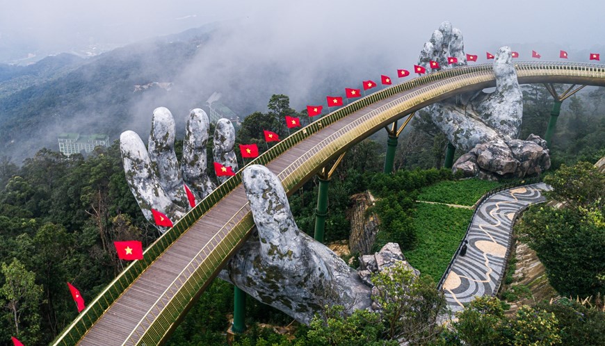 The Golden Bridge is found inside the Ba Na Hills entertainment - tourism complex. It was built at a height of 1,400 meters above sea level and stretches some 150 metres in length. The name “Golden Bridge” comes from its gilded railing frame. More than ju