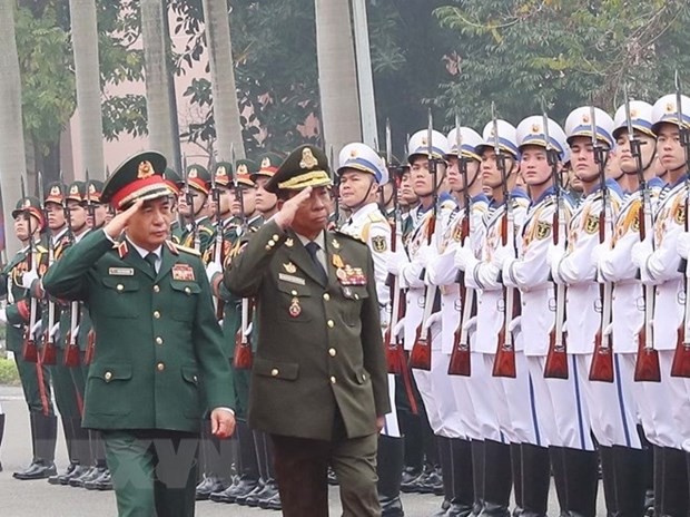 Vietnamese Defence Minister Gen. Phan Van Giang (L) and Cambodian Deputy PM and Defence Minister Gen. Tea Banh review the guard of honour at the welcome ceremony for the latter in Hanoi on February 19. (Source: VNA)