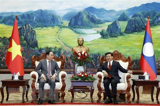 General Secretary, President of Laos received Vietnamese Party delegation