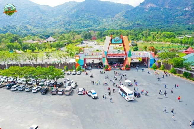 Tourists are crowded at the cable car departure to sacred legendary Thien Cam Mountain