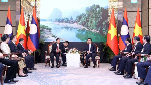 President delighted at growing special solidarity between Vietnam and Laos