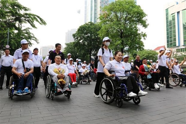 Persons with disabilities attend the event. (Photo: VNA)