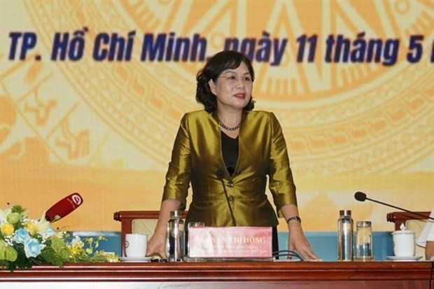 Nguyen Thi Hong, Governor of the State Bank of Vietnam, assures that the banking industry would continue to help businesses overcome their difficulties and restore their health. — Photo courtesy of SBV