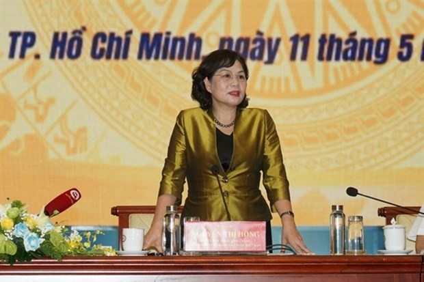 Nguyen Thi Hong, Governor of the State Bank of Vietnam, assures that the banking industry would continue to help businesses overcome their difficulties and restore their health. &mdash; Photo courtesy of SBV