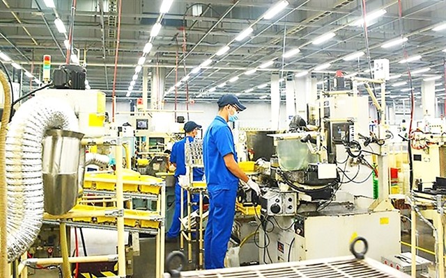 Workers at a factory in HCM City. The city seeks to revive industrial growth. — VNA/VNS Photo Workers at a factory in HCM City. The city seeks to revive industrial growth. — VNA/VNS Photo