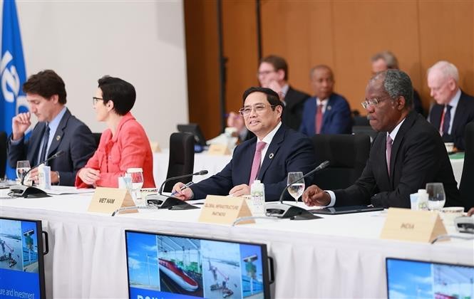 Thủ tướng Phạm Minh Chính tham dự phiên thảo luận “Cùng hợp tác giải quyết đa khủng hoảng”. Ảnh: Dương Giang - TTXVN