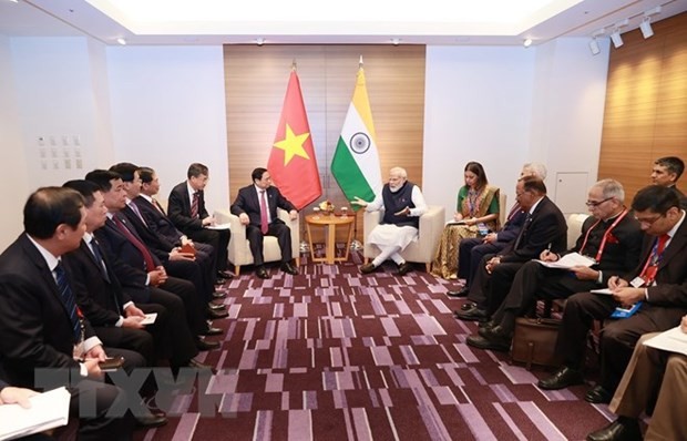 Prime Minister Pham Minh Chinh (L) and his Indian counterpart Narendra Modi at their (Photo: VNA)