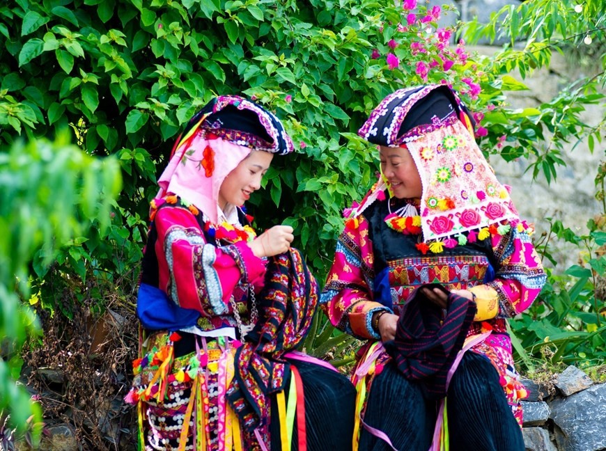 Lo Lo women sew and mbroider their own costumes. (Photo: VNA)