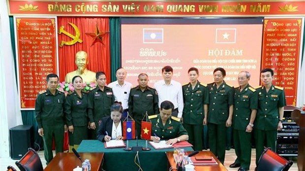 Son La, Laos’ Xayabury province exchange experience in veteran affairs