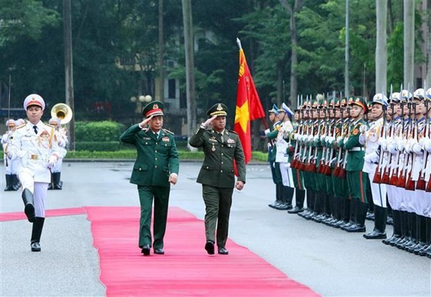 Defence Minister of Vietnam Gen. Phan Van Giang (L) and Deputy PM and Defence Minister of Cambodia Gen. Tea Seiha review the guard of honour at the welcome ceremony for the Cambodian delegation in Hanoi on November 13. (Photo: VNA)