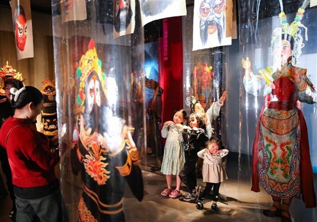 Visitors at the exhibition introducing tuong (classical drama). (Photo: VNA)
