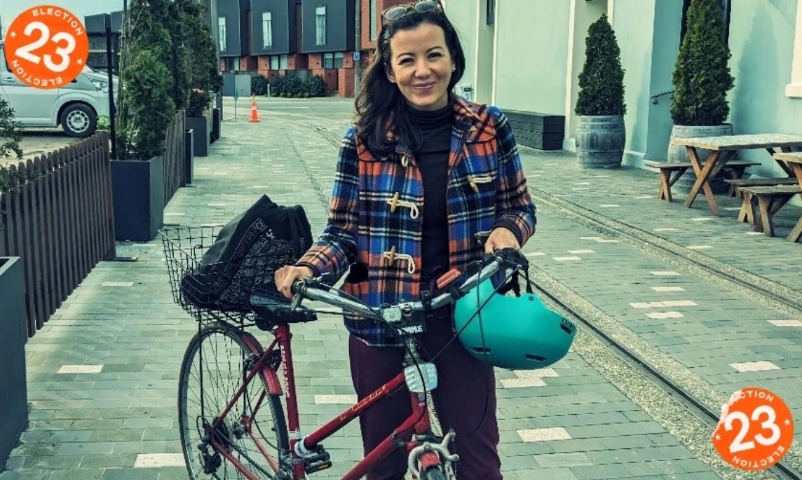 Ms. Pham Thi Ngoc Lan next to her familiar bicycle. (Photo: Shanti Mathias)