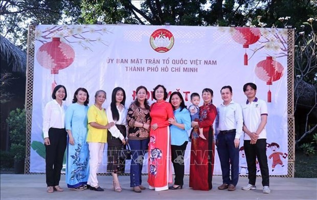 Lao and Cambodian students and their Vietnamese foster parents. (Photo: VNA)