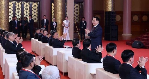 National Assembly Chairman Vuong Dinh Hue attends the seminar in Beijing on April 9. (Source: VNA)