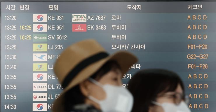 A flight information display system shows the departure time to cities overseas at Incheon International Airport, Tuesday. Yonhap