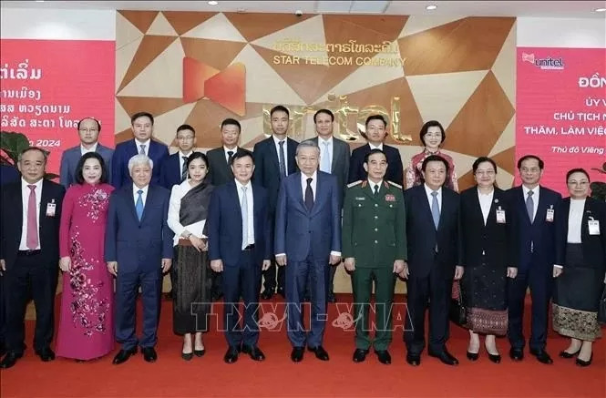 President To Lam visits telecom joint venture Star Telecom in Laos President To Lam visits telecom joint venture Star Telecom in Laos