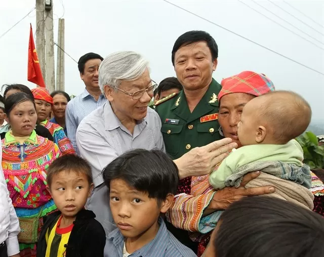 Party General Secretary Nguyễn Phú Trọng talked with ethnic minority people at Bản Khăm I hamlet, Trung Lý commune, Mường Lát district in Thanh Hóa Province in 2011. VNA/ Party General Secretary Nguyễn Phú Trọng talked with ethnic minority people at Bản Khăm I hamlet, Trung Lý commune, Mường Lát district in Thanh Hóa Province in 2011. VNA/