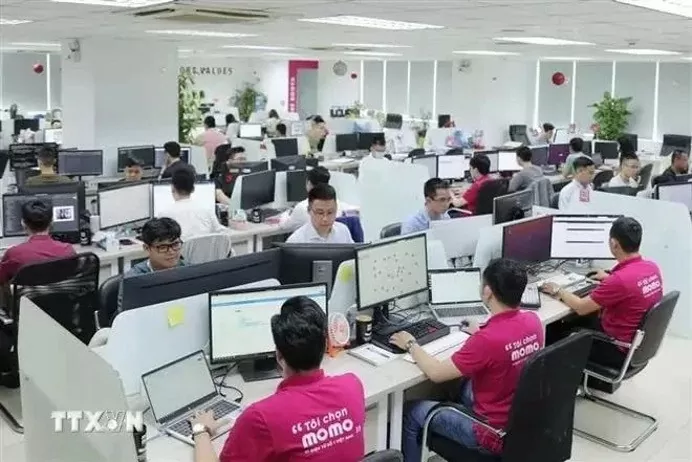 The Momo e-wallet staff at their office. (Photo: VNA) The Momo e-wallet staff at their office. (Photo: VNA)