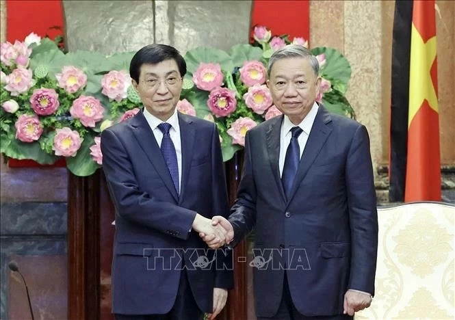 President To Lam (R) and Chairman of the National Committee of the Chinese People's Political Consultative Conference Wang Huning President To Lam (R) and Chairman of the National Committee of the Chinese People's Political Consultative Conference Wang Huning