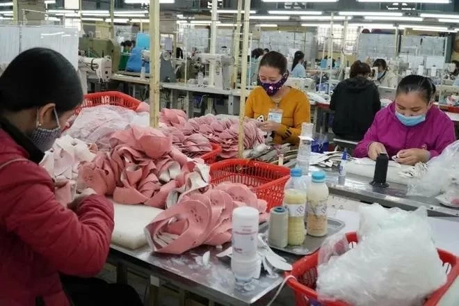 Producing footwear for export (Photo: VNA) Producing footwear for export (Photo: VNA)