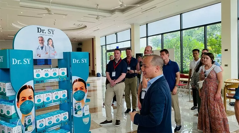 Wisconsin’s researchers visit Dr. Sy's mask production area.