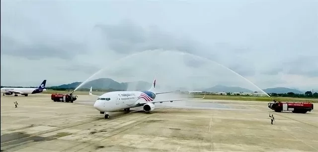 A plane from Malaysia Airlines is welcomed at Da Nang International Airport. The airport has been preparing for new growth in the decades ahead. (Photo courtesy of ACV Da Nang) A plane from Malaysia Airlines is welcomed at Da Nang International Airport. The airport has been preparing for new growth in the decades ahead. (Photo courtesy of ACV Da Nang)
