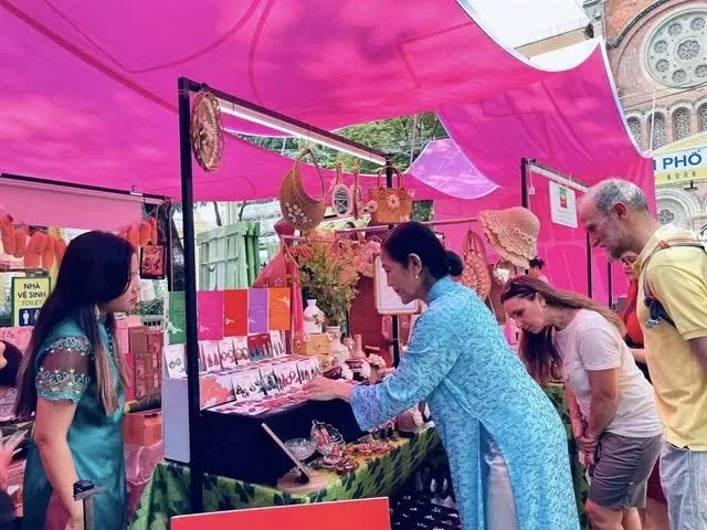 Art programme honouring Ao dai opens at HCM City Book Street