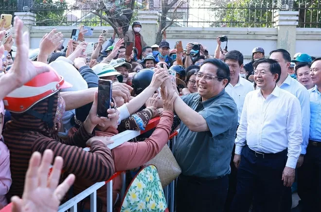 PM Pham Minh Chinh and local residents during his visit to Binh Dinh province on March 22 (Photo: VNA) PM Pham Minh Chinh and local residents during his visit to Binh Dinh province on March 22 (Photo: VNA)