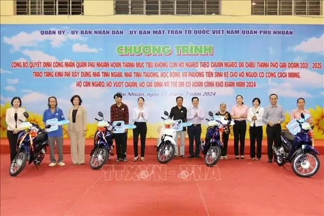 Near-poor and disadvantaged households in HCM City’s Phu Nhuan district receive motorbikes as a means of livelihood. (Photo: VNA) Near-poor and disadvantaged households in HCM City’s Phu Nhuan district receive motorbikes as a means of livelihood. (Photo: VNA)