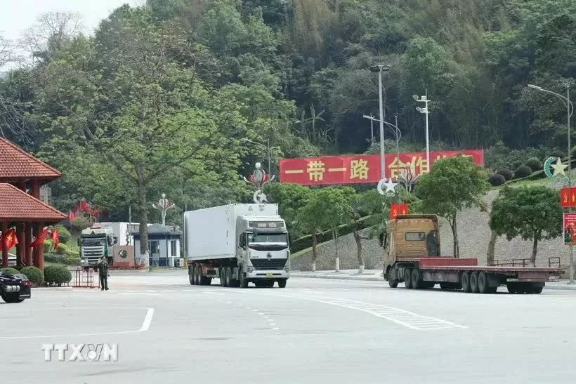 Trucks carry imported/exported goods at Huu Nghi border gate in the northern province of Lang Son. Trucks carry imported/exported goods at Huu Nghi border gate in the northern province of Lang Son.