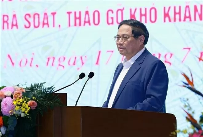 Prime Minister Pham Minh Chinh attends national conference, calls for swift and humane resolution of stalled projects