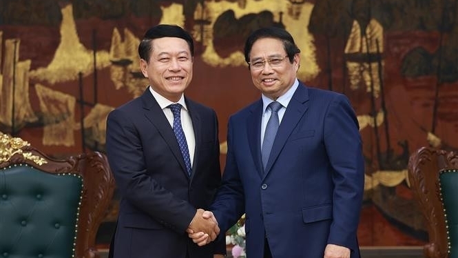 Prime Minister Pham Minh Chinh receives Lao delegation for SOE reform