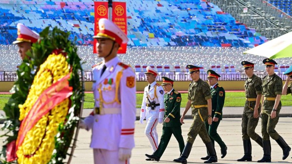 Russian, Lao, and Cambodian military personnel pay respects at President Ho Chi Minh Mausoleum