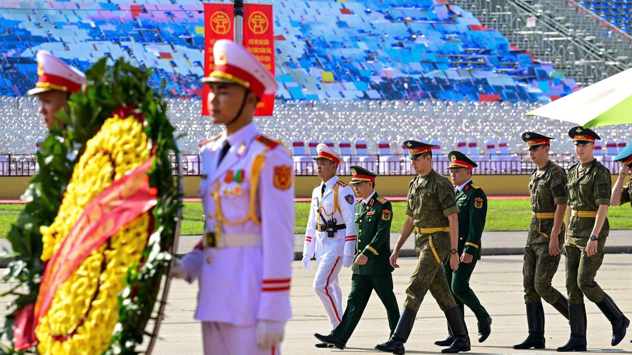 Russian, Lao, and Cambodian military personnel pay respects at President Ho Chi Minh Mausoleum