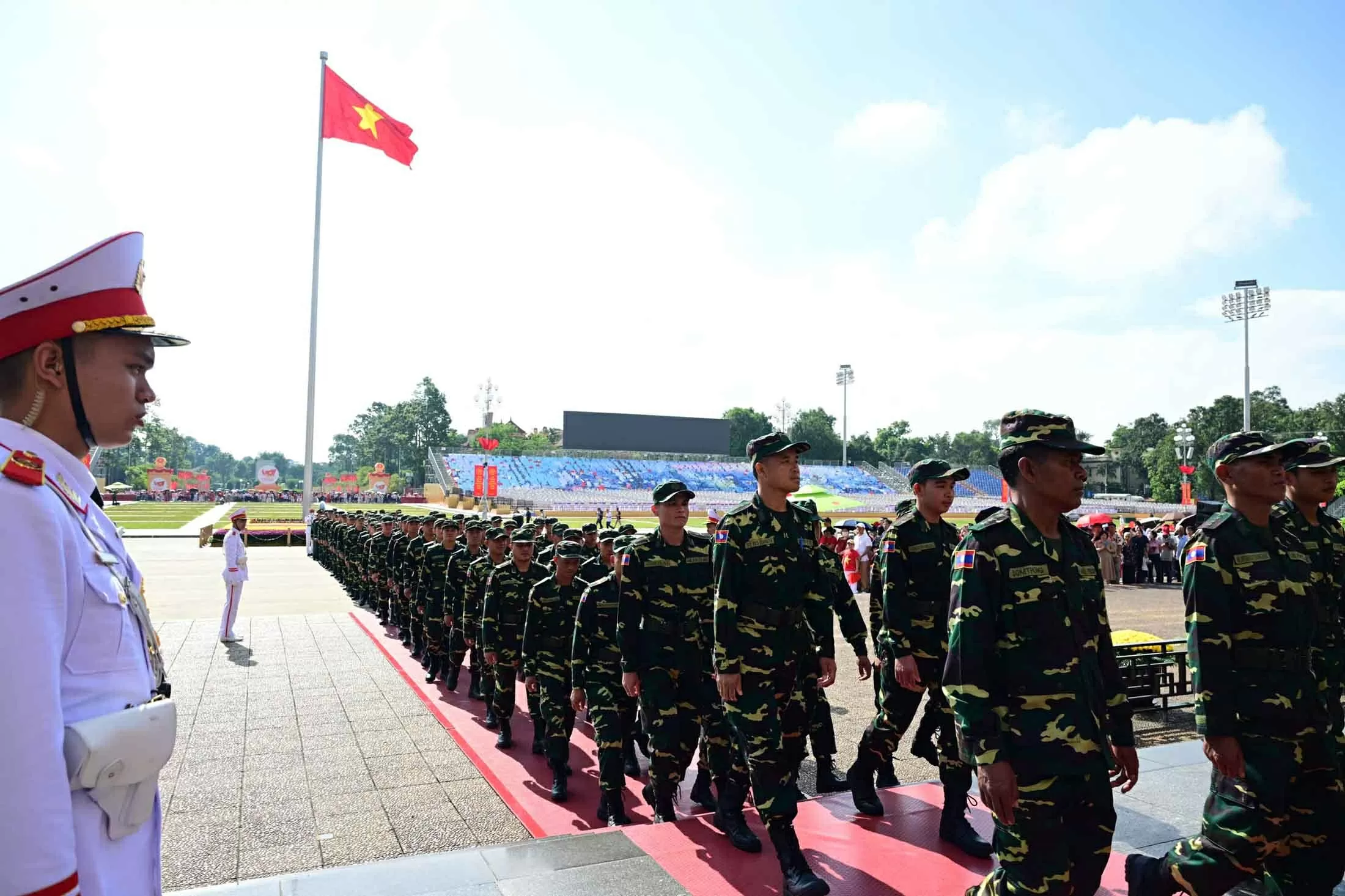 Russian, Lao, and Cambodian military personnel pay respects at President Ho Chi Minh Mausoleum