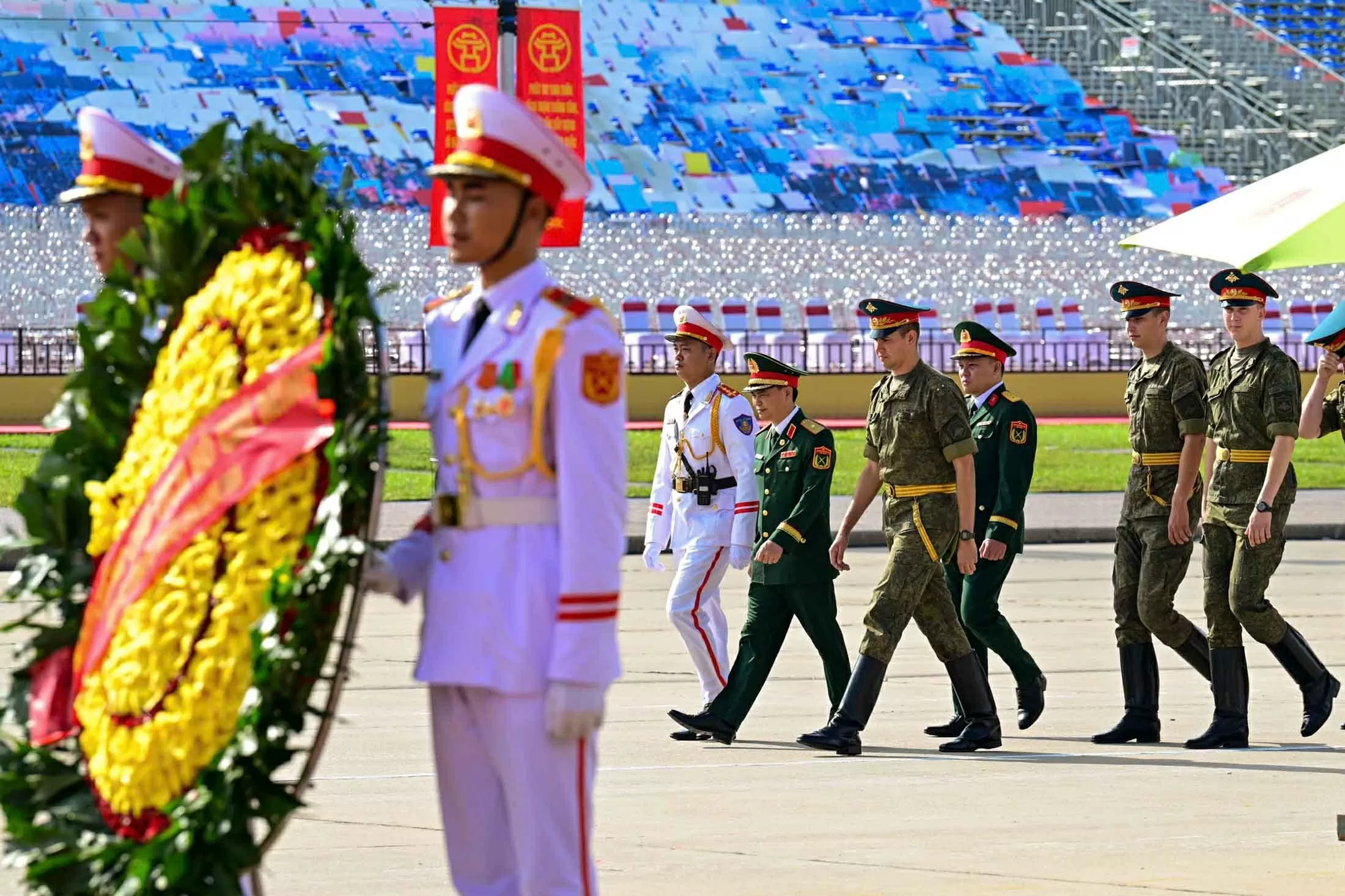 Russian, Lao, and Cambodian military personnel pay respects at President Ho Chi Minh Mausoleum
