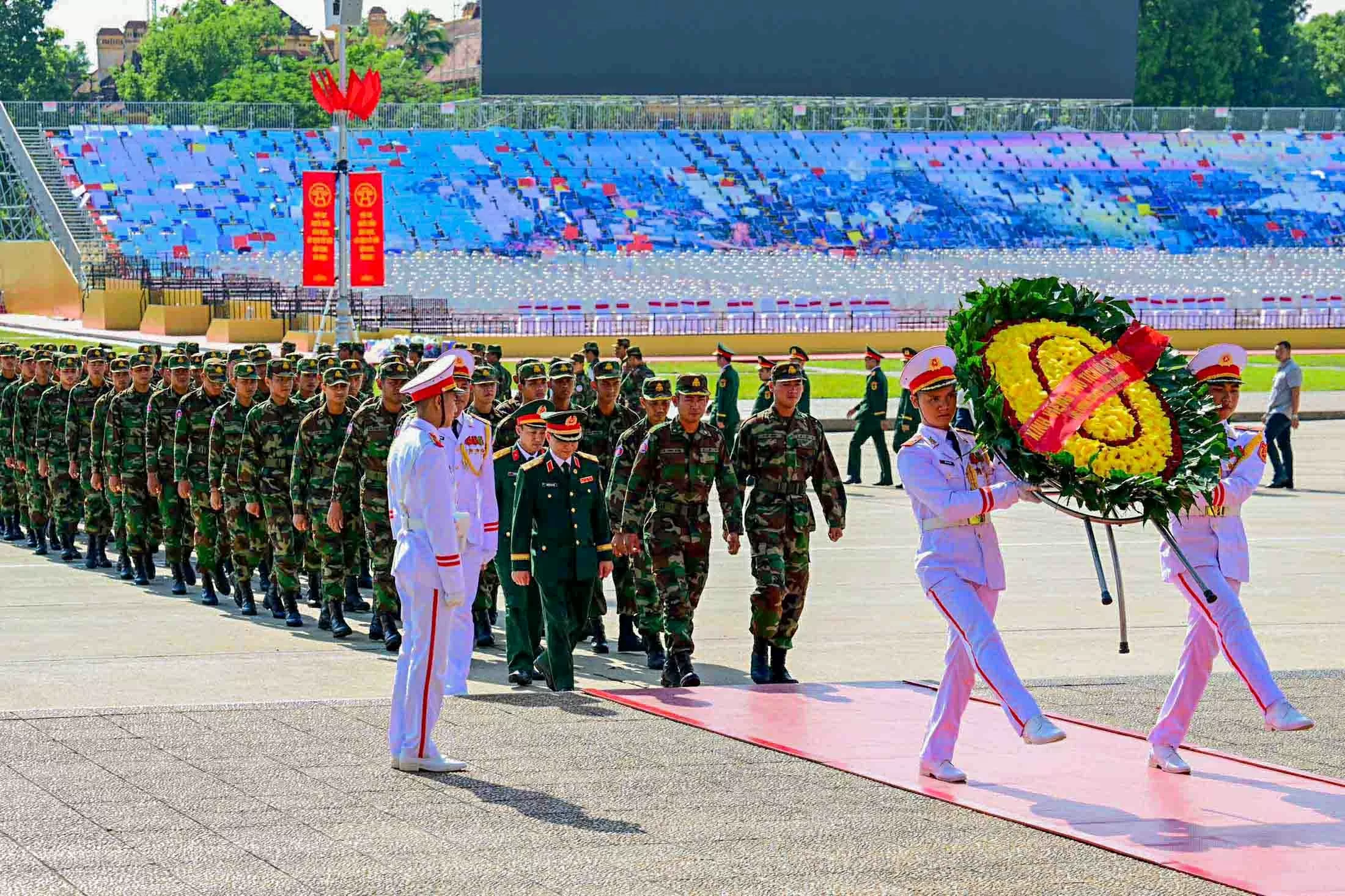 Russian, Lao, and Cambodian military personnel pay respects at President Ho Chi Minh Mausoleum