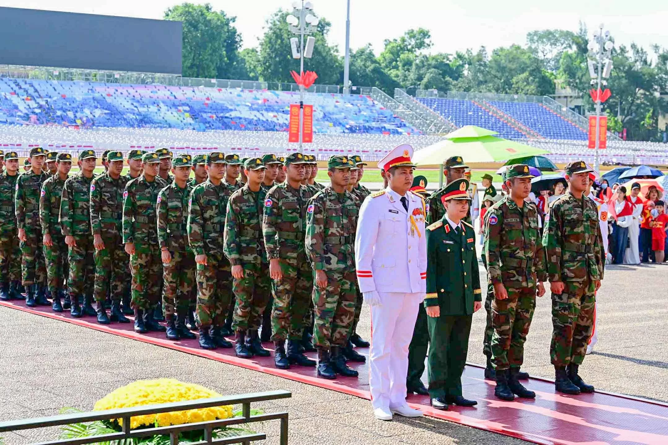 Russian, Lao, and Cambodian military personnel pay respects at President Ho Chi Minh Mausoleum