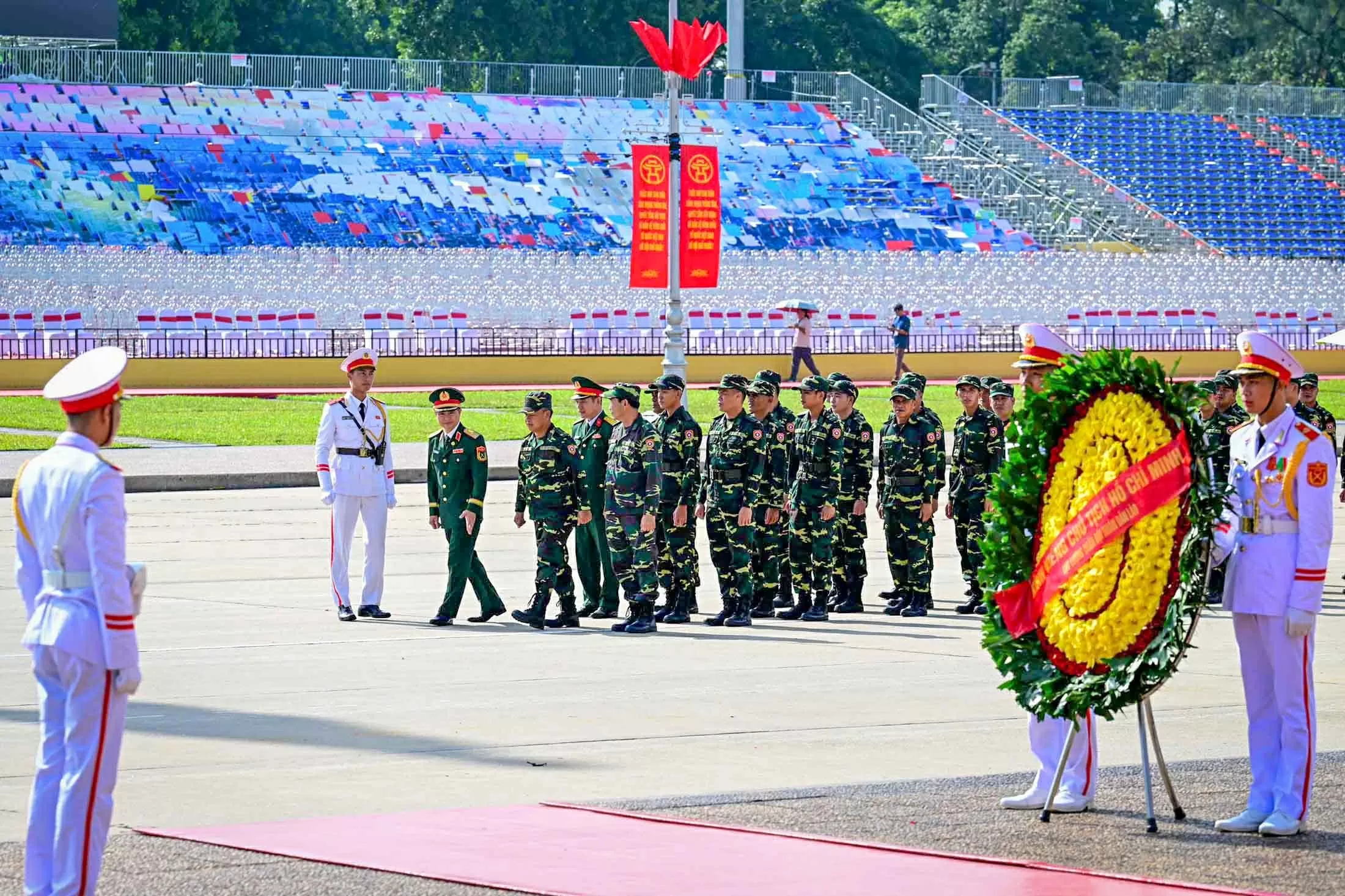 Russian, Lao, and Cambodian military personnel pay respects at President Ho Chi Minh Mausoleum