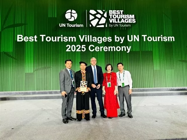 Representatives of Tuyen Quang province and organising committee pose for photo after Lô Lô Chải is honoured one of best tourism villages in 2025. — (Photos courtesy of Tuyen Quang province) Representatives of Tuyen Quang province and organising committee pose for photo after Lô Lô Chải is honoured one of best tourism villages in 2025. — (Photos courtesy of Tuyen Quang province)