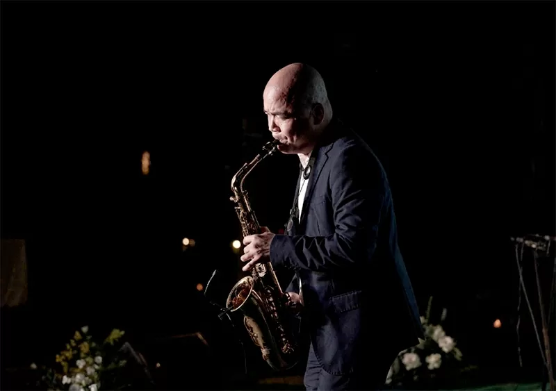 Mr Ha Huy Thanh performs a saxophone piece as a gift to the guests attending the book launch ceremony (Photographer: Lukas Vrtilek, Photo Credit: Disa).