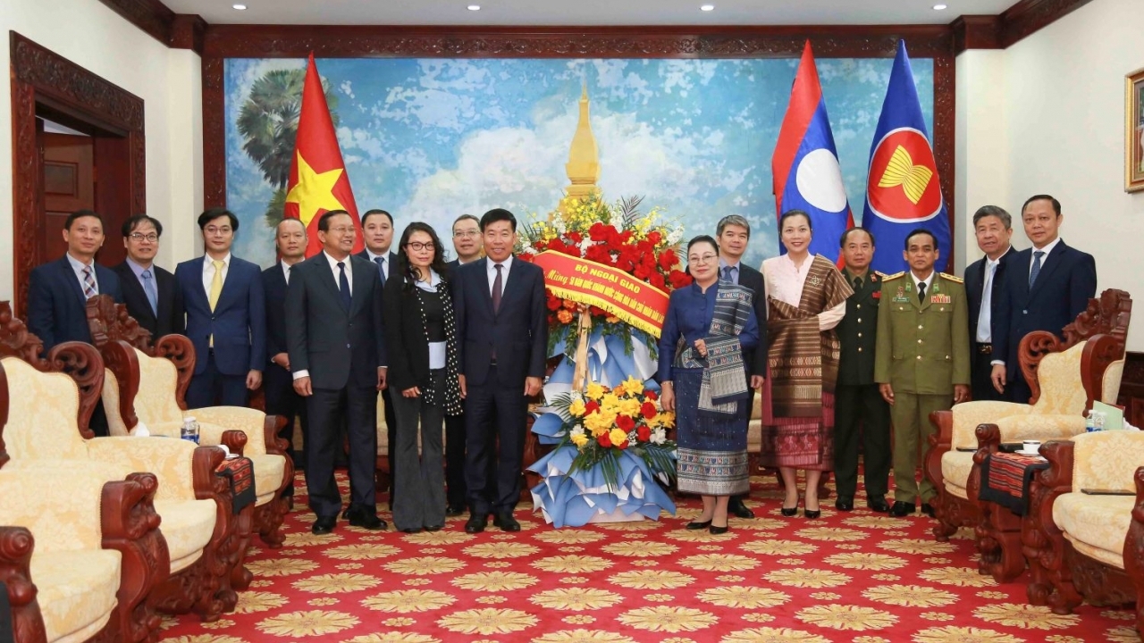 Deputy FM Nguyen Manh Cuong congratulates Lao Embassy in Vietnam on National Day