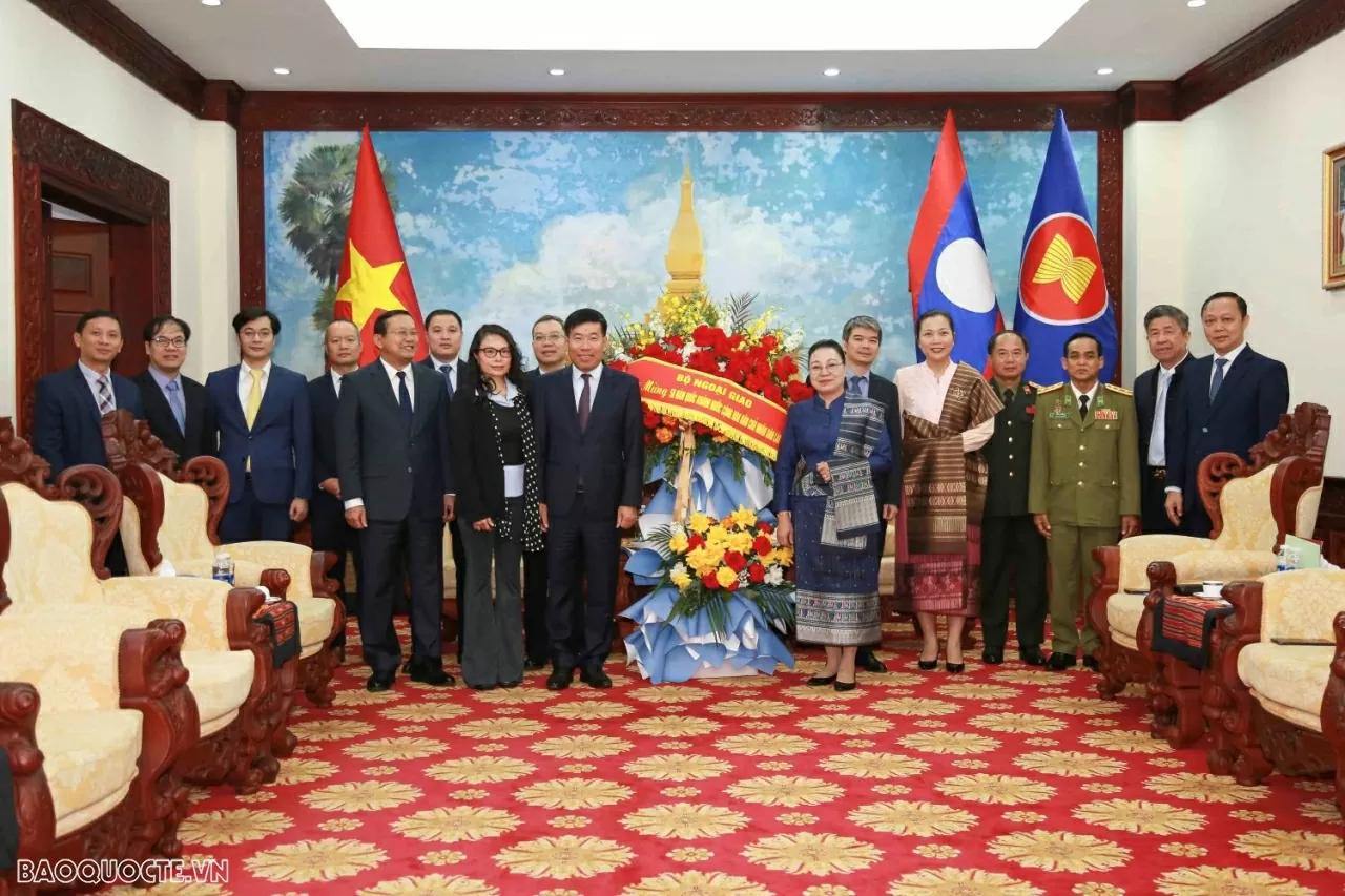 Deputy FM Nguyen Manh Cuong congratulates Lao Embassy in Vietnam on National Day