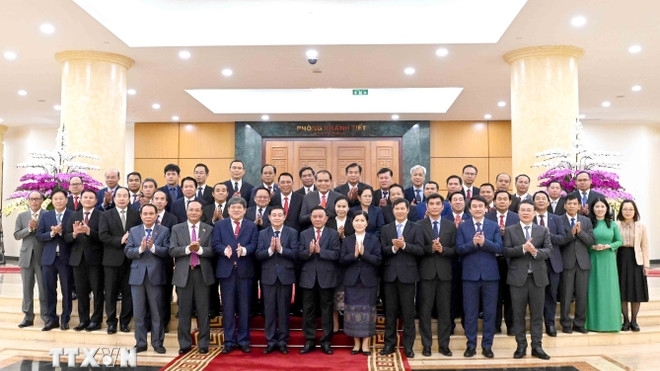 Politburo Member Tran Cam Tu welcomes high-level delegation from the Lao People's Revolutionary Party
