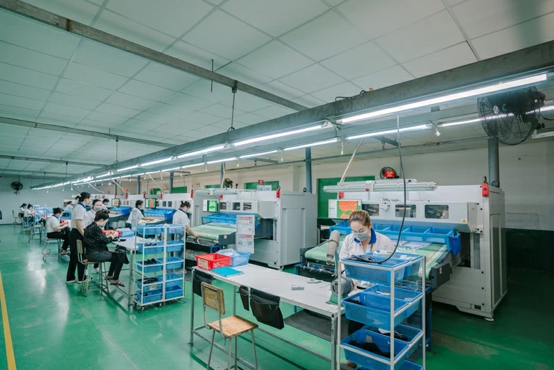 Factory workers at one of PUMA’s Vietnam suppliers. Factory workers at one of PUMA’s Vietnam suppliers.