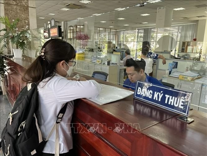A resident conducts transactions at the Ho Chi Minh City tax department.