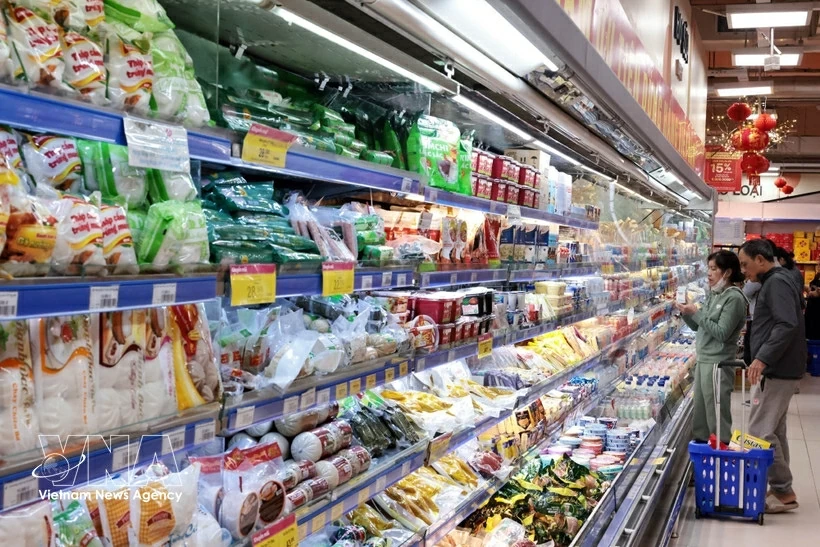 Customers shop for goods at Co.opmart Nguyen Trai supermarket in Hanoi. 