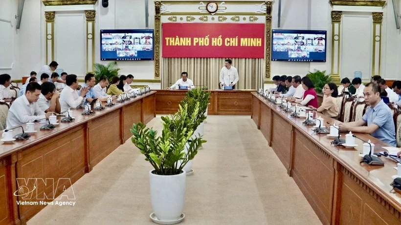 The working session between the Ho Chi Minh City People’s Committee and relevant departments, agencies and localities on February 28. (Photo: VNA)