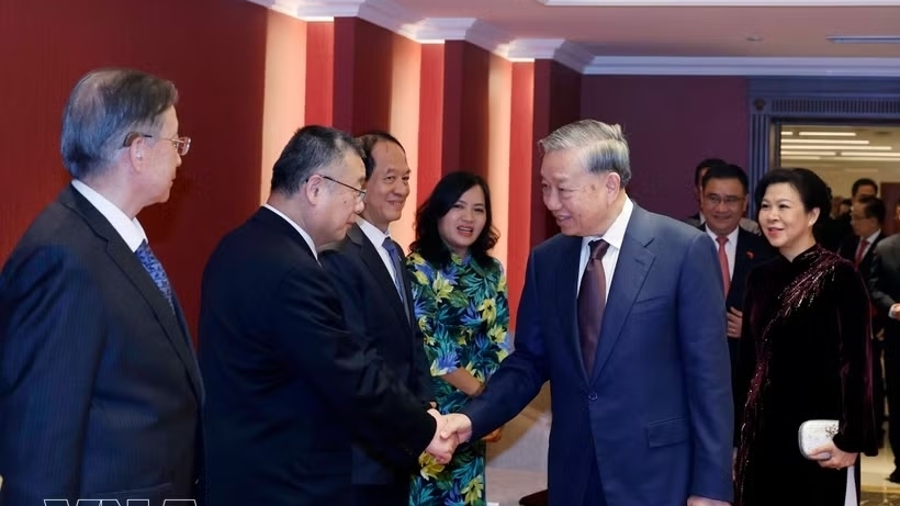General Secretary, President To Lam meets families of Vietnam-China friendship contributors in Beijing