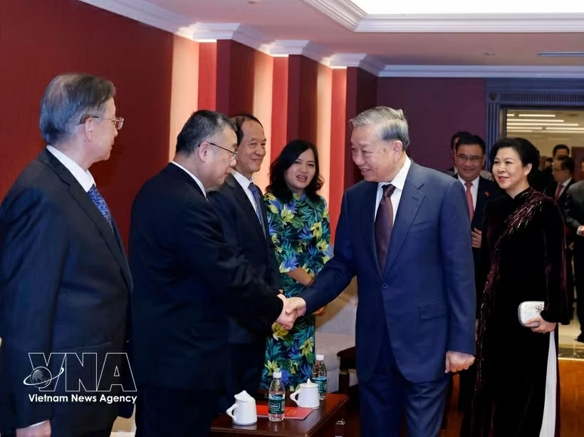 General Secretary, President To Lam meets families of Vietnam-China friendship contributors in Beijing